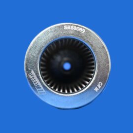 Close-up of a silver circular metal ring with a ridged inner opening, set against a solid blue background.