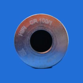 Close-up of a metal washer-like ring with a central hole, showing rust tones and engraved text (e.g., CR 10/1) on a solid blue background.