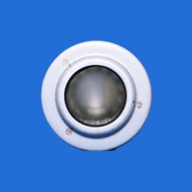 Close-up of a white circular metal ring with a hollow center on a solid blue background.