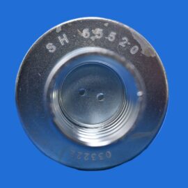 Close-up of a metal dial with engraved numbers on a circular ring, set against a solid blue background.