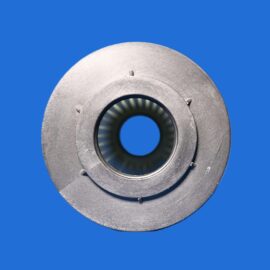 Close-up of a brushed metal circular mechanical part with a hollow center and small tabs against a solid blue backdrop.