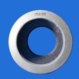 Close-up of a silver metal circular flange with a textured inner edge against a bright blue background.