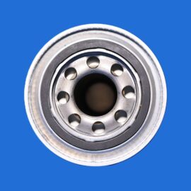 Close-up of a metal car wheel hub with circular holes, set against a blue background.