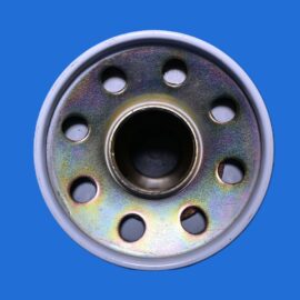 Close-up of a perforated metal disc with evenly spaced holes on a blue background.