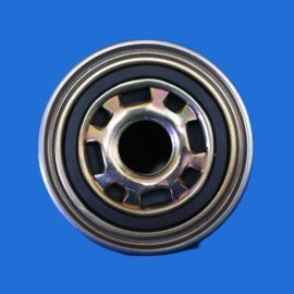 Close-up of a metal ball bearing with inner race and housing against a solid blue background