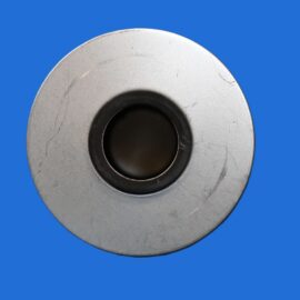 Close-up of a large metal washer with a central hole on a solid blue background
