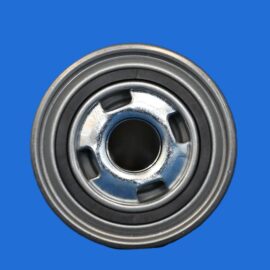 Close-up of a metal bearing with inner rings on a blue background.