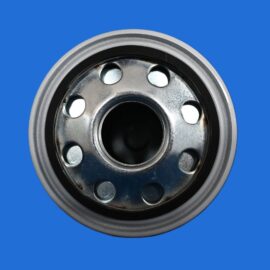 Close-up of a shiny metal wheel hub with circular holes against a solid blue background, showing lug-like openings and inner bore color.