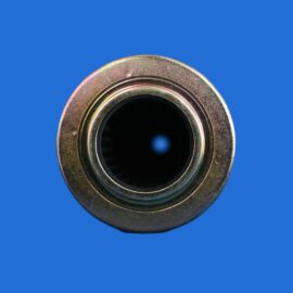Macro close-up of a metallic circular ring bearing or nut with a dark hollow center on a solid blue background.