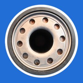 Close-up of a metal wheel hub with bolt holes against a blue background, showing circular holes and inner bore.