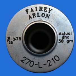 Close-up of a metallic circular dial with black engraved text around its rim on a blue background, suggesting a control knob or indicator.