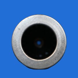 Close-up of a silver metal cylinder opening against a blue background.