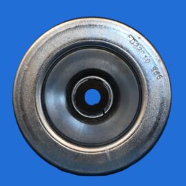 Close-up of a metallic circular bearing/pulley with a central hole against a solid blue background, showing wear on the rim.