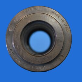 Close-up of a metal bearing with 'MADE IN ITALY' engraved, against a blue background.