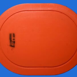 Close-up of an orange basketball against a blue background, showing the textured surface and seam lines.
