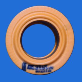 Close-up of an orange rubber gasket ring on a blue background, showing concentric ridges and inner hole density.