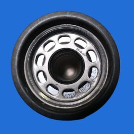 Close-up of a metal car wheel hub with circular cutouts, set against a solid blue background.