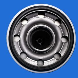 Close-up of a metallic ball bearing with circular rings on a solid blue background.