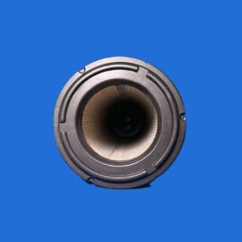 Close-up, top-down view of a camera lens opening against a solid blue background