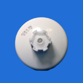 Close-up of a white plastic bottle neck with a central gray stopper against a solid blue background