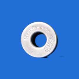 Close-up of a silver metal ring with a central hole, stamped with 'West Germany' on a blue background.