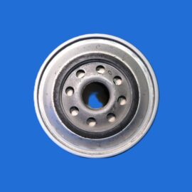Close-up of a metal car wheel hub with circular holes, set against a solid blue background.