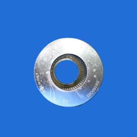 Close-up of a silver metal washer with a threaded inner hole on a blue background.