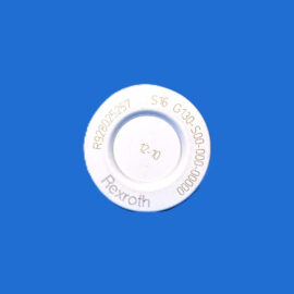 White circular dial with embossed numbers partially visible against a blue background, close-up view.