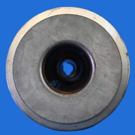 Close-up of a circular metal grinding wheel with a central bore, shown against a solid blue background.
