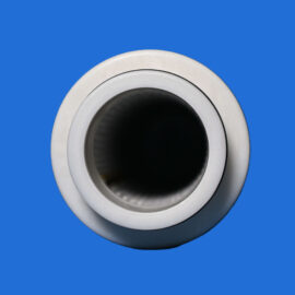 Close-up of a silver metal tube opening with a dark interior, set against a bright blue background.