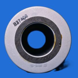 Close-up of a metal washer with a central hole and stamped numbers against a blue background.